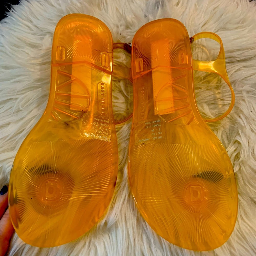 Katy Perry’s peach/orange jelly sandals. Excellent condition.
